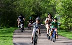 Bikers enjoy a stretch of the Bruce Vento trail that intersects with the Gateway Trail in Maplewood.