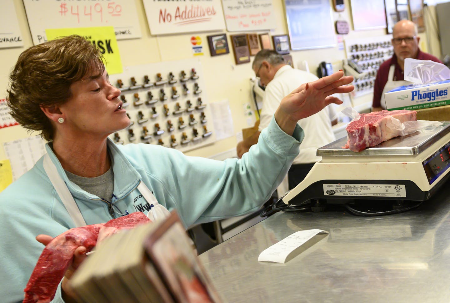 Kitty Sedesky, of Excelsior, a 20-year employee of Hackenmueller's Meat Market in Robbinsdale, weight out a pair of roasts for a customer Friday afternoon. ] Aaron Lavinsky &#x2022; aaron.lavinsky@startribune.com A strip of Broadway Avenue in Robbinsdale is rapidly turning into a walkable "Eat Street" of locally-owned restaurants and shops. A new brewery now sits across from a popular Costa Rican joint. Down the block is Pig Ate My Pizza and the owners of The Bulldog will soon open a new casual