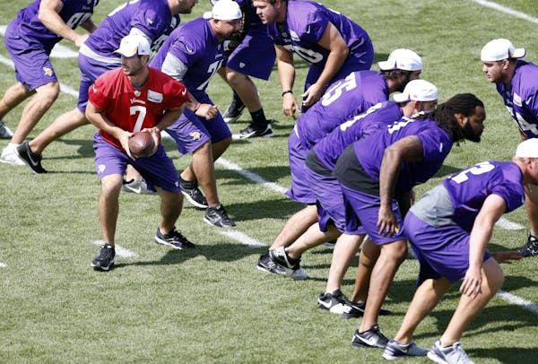 Vikings quarterback Christian Ponder (7) looked to handoff during the morning practice on Monday.