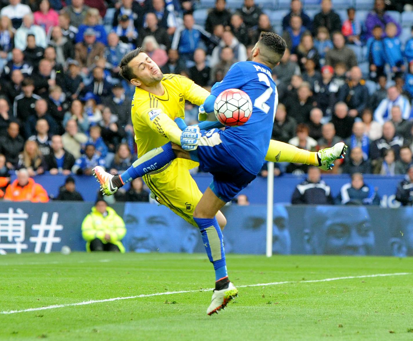 Swansea's Lukasz Fabianski, left, clashed with Leicester's Riyad Mahrez during an English Premier League soccer match at the King Power Stadium in Leicester, England, on Sunday.