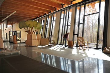 Eastman Nature Center at Elm Creek Park Reserve has windows canted forward to prevent bird strikes, so the bird see a reflection of the ground rather 