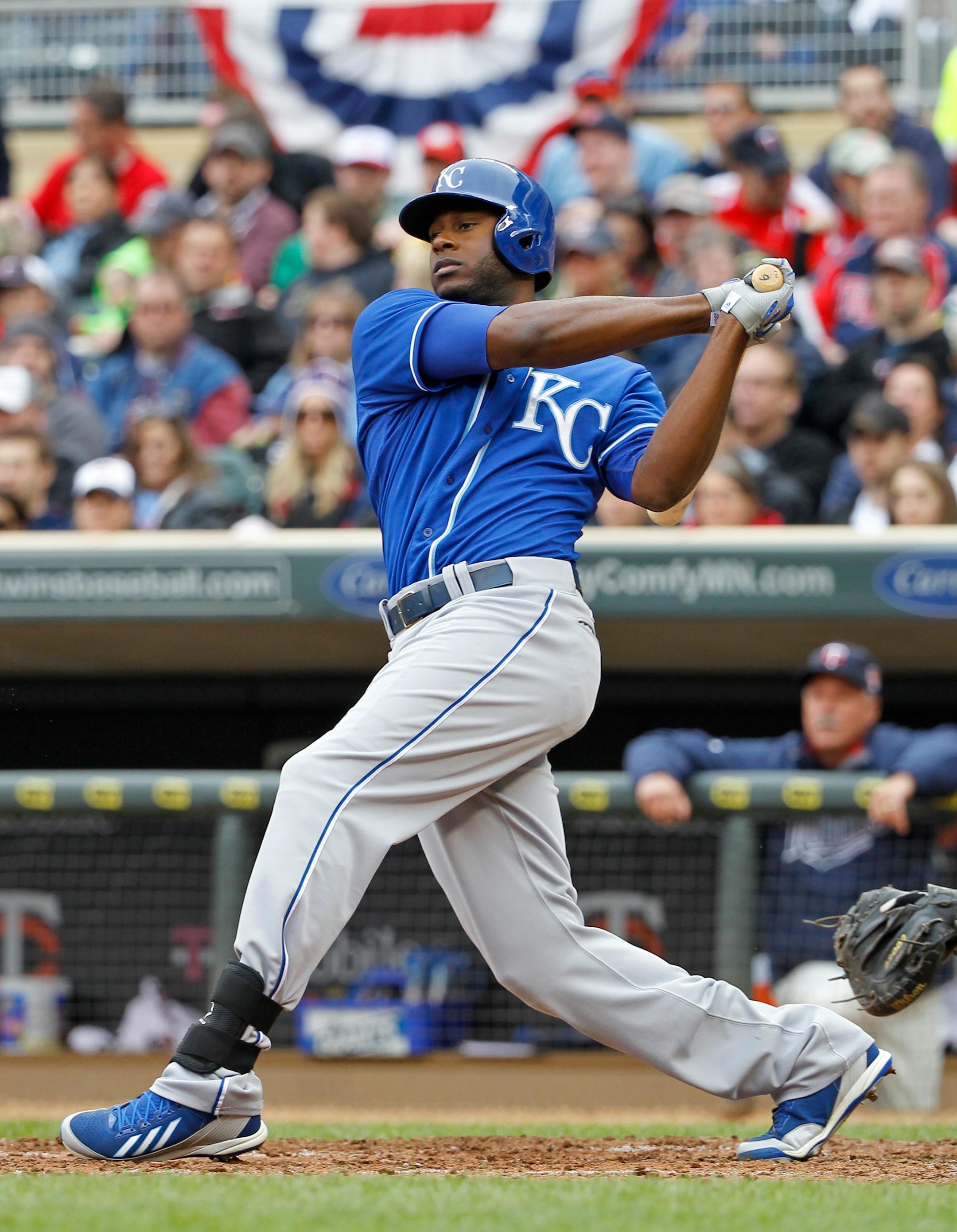 Kansas City Royals' Lorenzo Cain follows through on a one-run double off Minnesota Twins pitcher Ricky Nolasco during the fifth inning of a baseball game in Minneapolis, Saturday, April 12, 2014. The Twins won 7-1.(AP Photo/Ann Heisenfelt)