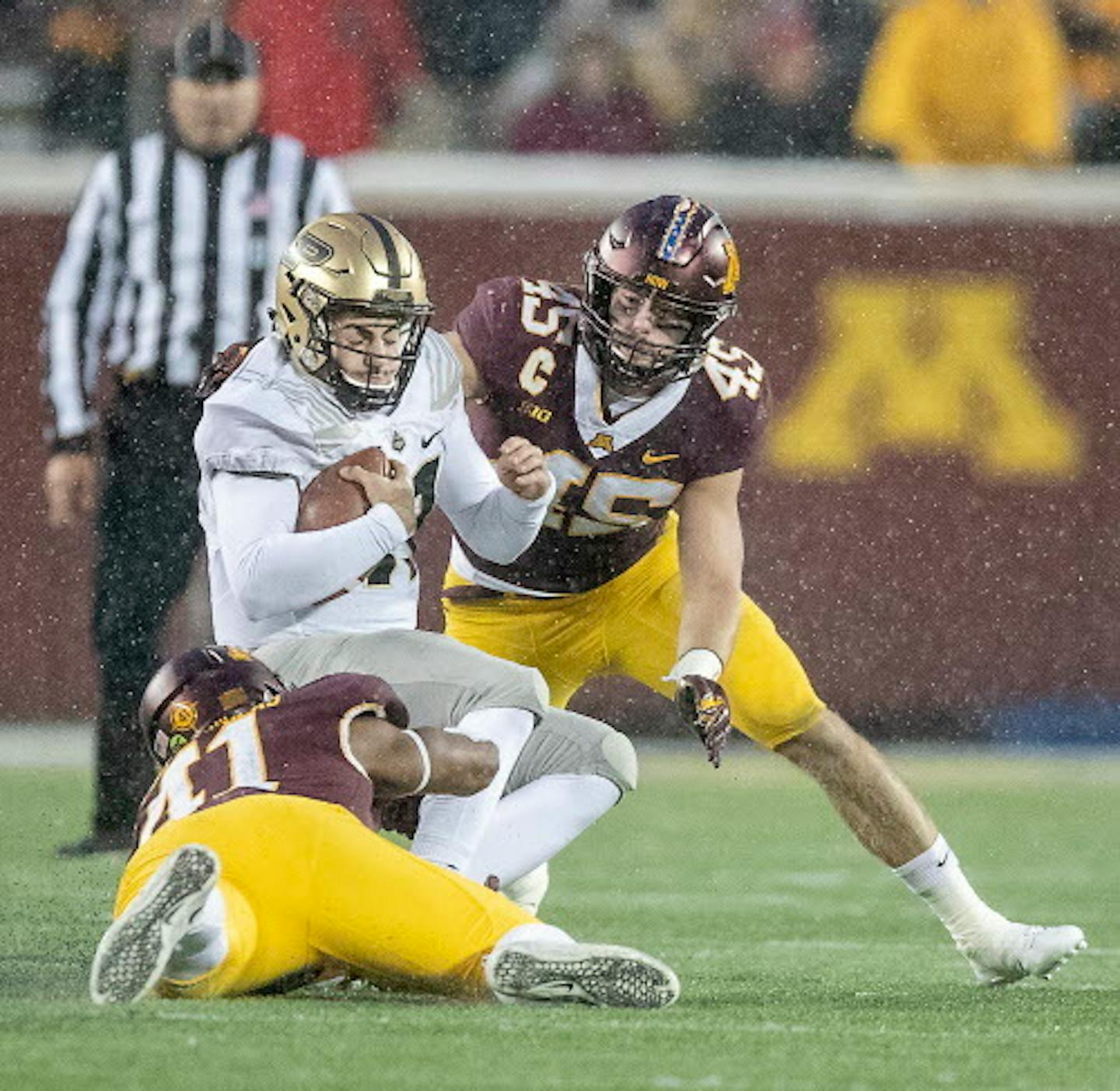 Minnesota's linebackers Carter Coughlin, right, and Thomas Barber brought down Purdue's quarterback David Blough during the third quarter as Minnesota took on Purdue at TCF Bank Stadium, Saturday, November 10, 2018 in Minneapolis, MN.    ]  ELIZABETH FLORES ' liz.flores@startribune.com