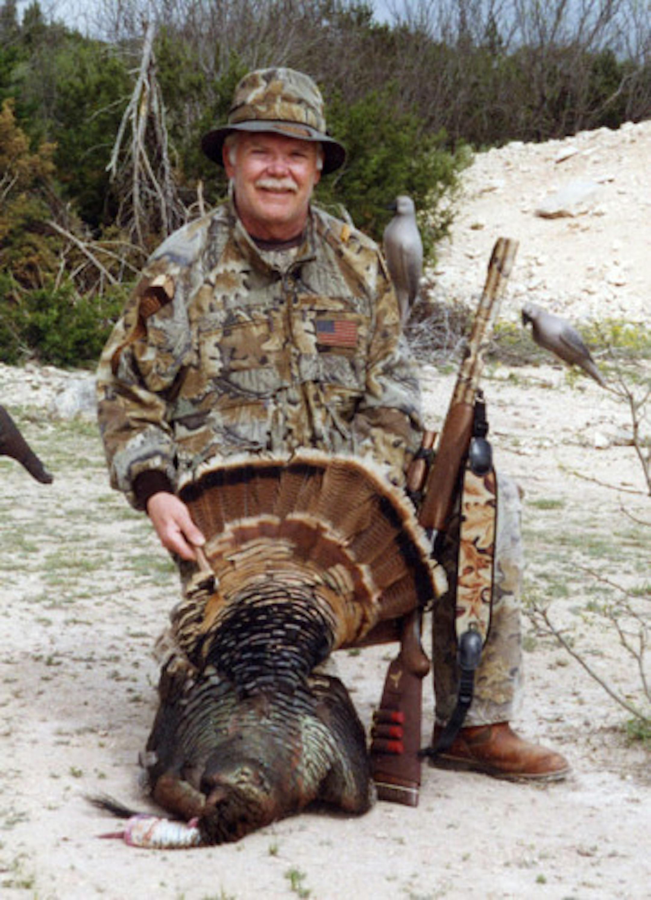 Dick Alford with a turkey he shot in Hawaii.