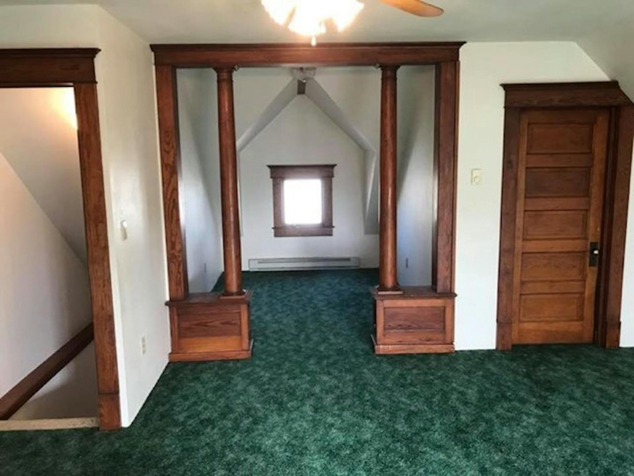This Iowa farmhouse's owners restored the woodwork to its early 20th-century grandeur. They offered the house for free on Craigslist, and found a Minnesota taker. Courtesy Roger Dolecheck