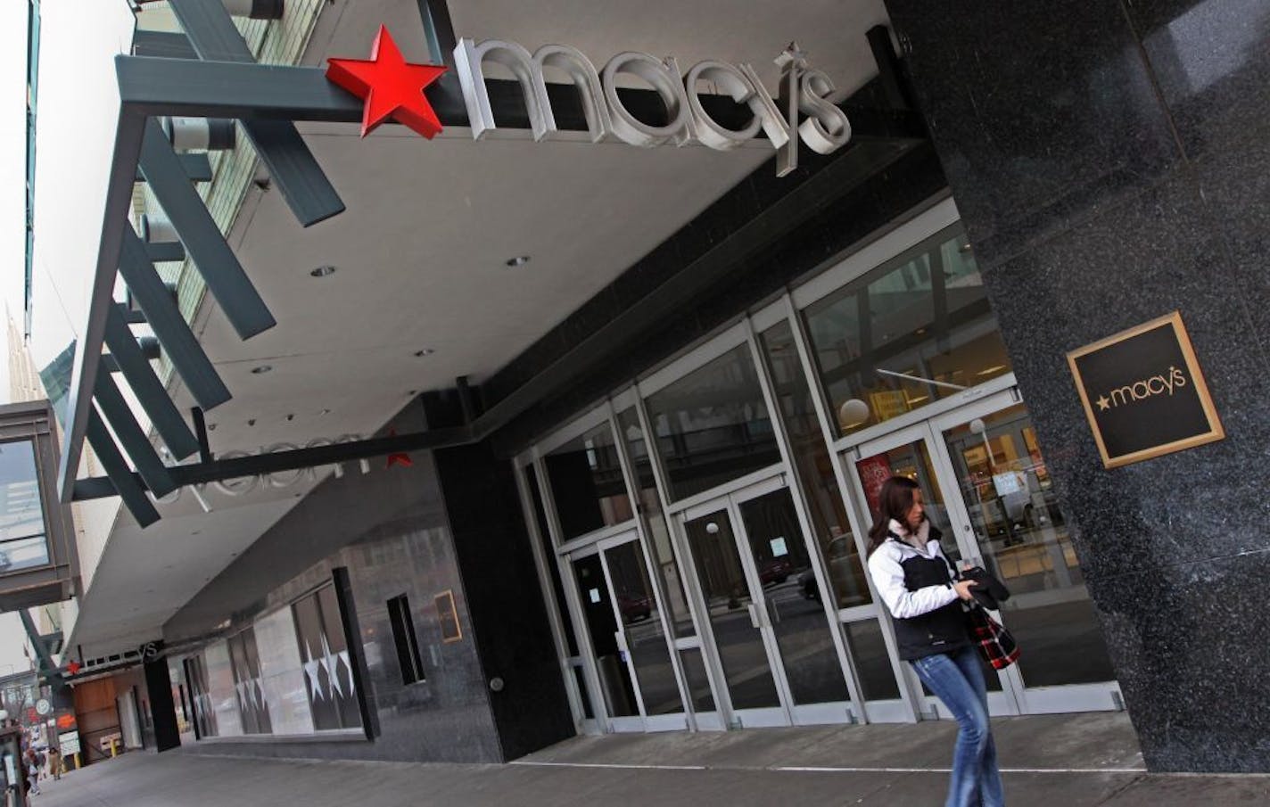 Customers left the downtown St. Paul Macy's after shopping on 1/12/12.