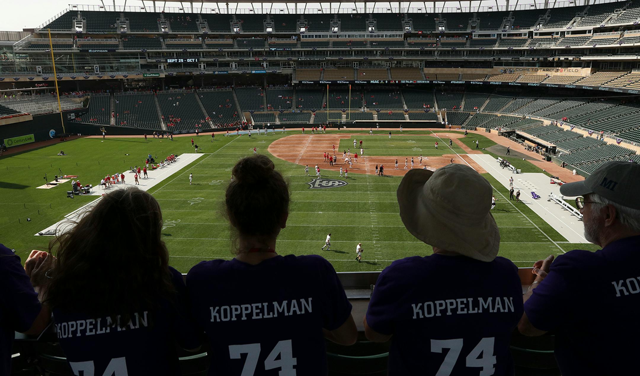 University of St. Thomas fans watched as St. John's University players warmed up prior to Saturday's game at Target Field.
