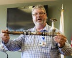 David Rydeen, physical plan director for the state Veterans Home in Hastings, displays a water pipe that has been repaired multiple times. The Hasting