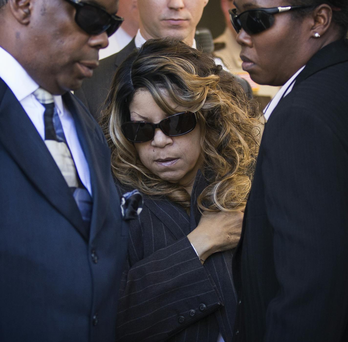 Prince's sister Tyka Nelson, center, leaves the Carver County Justice Center in Chaska with her husband Maurice Philips, left. ] (Leila Navidi/Star Tribune) leila.navidi@startribune.com BACKGROUND INFORMATION: Monday, May 2, 2016. With the approval of most of Prince&#x2019;s siblings, Carver County District Court Judge Kevin Eide confirmed the appointment of Bremer Trust, National Association as special administrator to manage the late musician&#x2019;s assets during a probate hearing at the Car