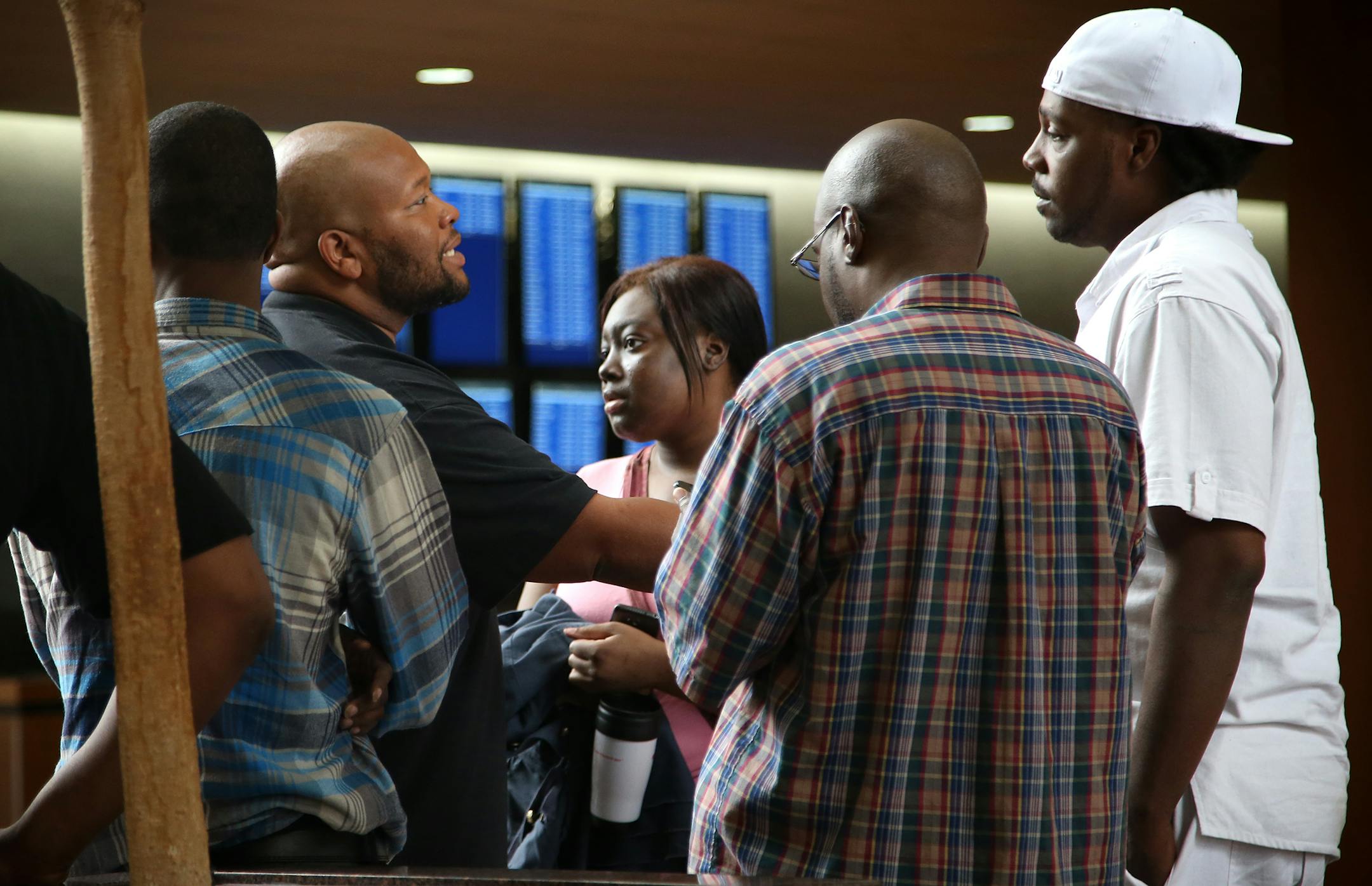 Family and friends of Devon Parker, who did not want to be identified, talk in the lobby of Government Center after Devon Parker's sentencing in Hennepin County Court on Thursday, June 4, 2015.