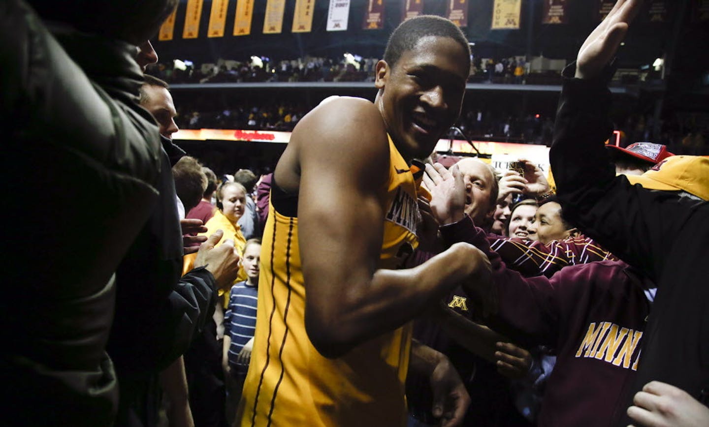 Rodney Williams celebrated with fans following the victory over Indiana.