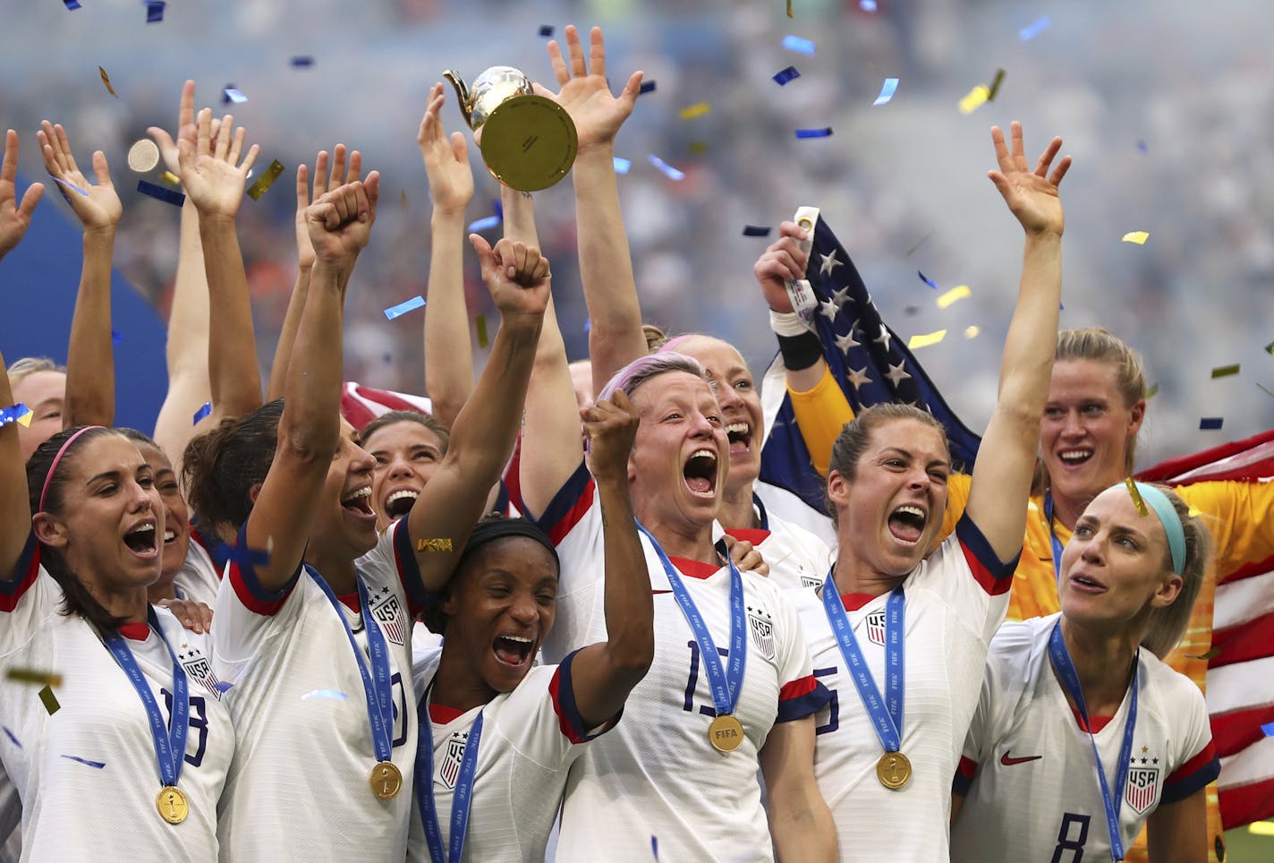 United States' Megan Rapinoe holds the trophy celebrating at the end of the Women's World Cup final soccer match between US and The Netherlands at the Stade de Lyon in Decines, outside Lyon, France, Sunday, July 7, 2019. The US defeated the Netherlands 2-0. (AP Photo/Francisco Seco) ORG XMIT: MER6101810d6483f9adff08e3609c493