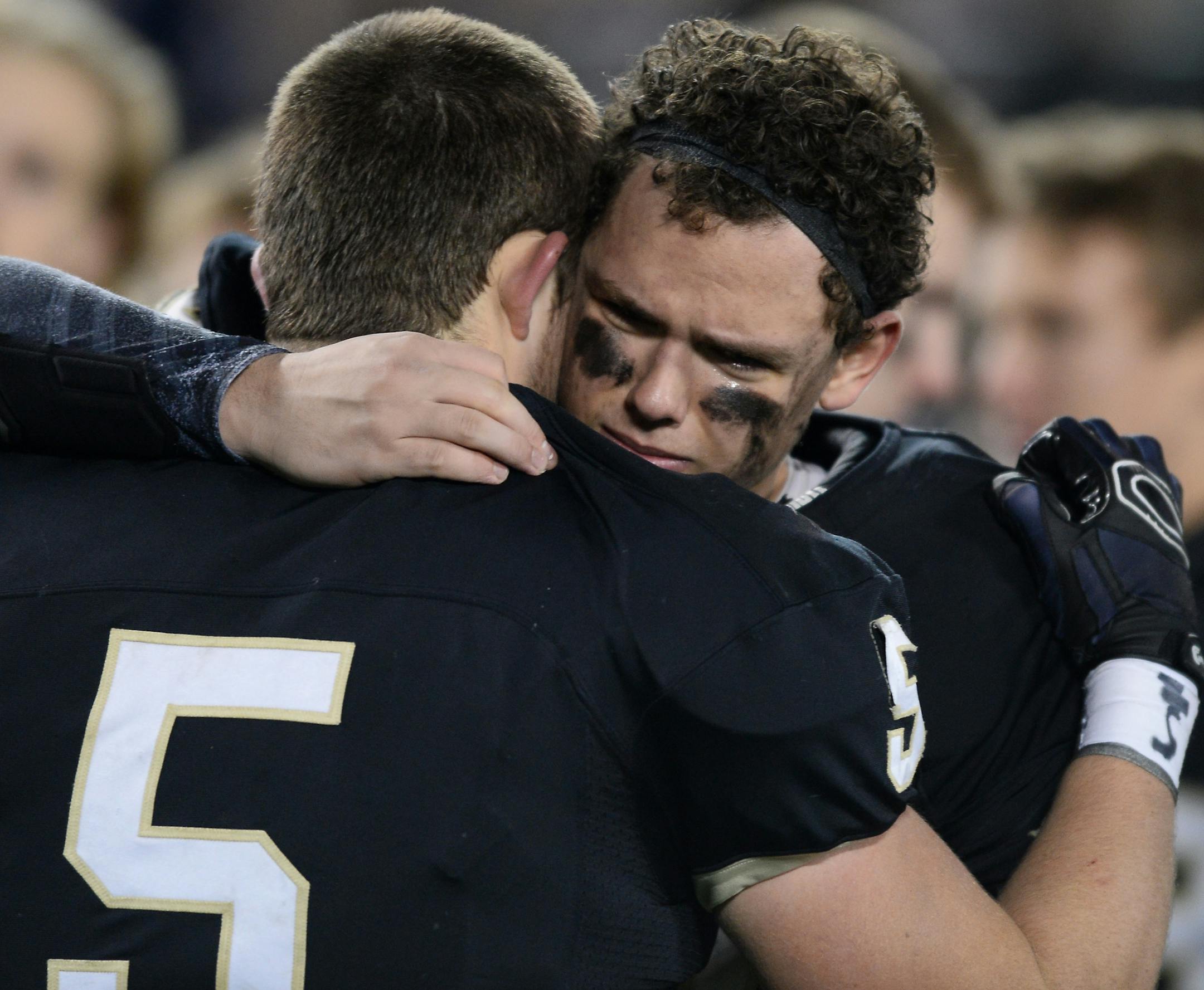East Ridge offensive lineman Brock Albrecht (54) and fullback Connor Mohs (5) were dejected after losing to Osseo in the 6A championship game. ] (AARON LAVINSKY/STAR TRIBUNE) aaron.lavinsky@startribune.com Osseo played East Ridge in the Class 6A championship game on Friday, Nov. 13, 2015 at TCF Bank Stadium.