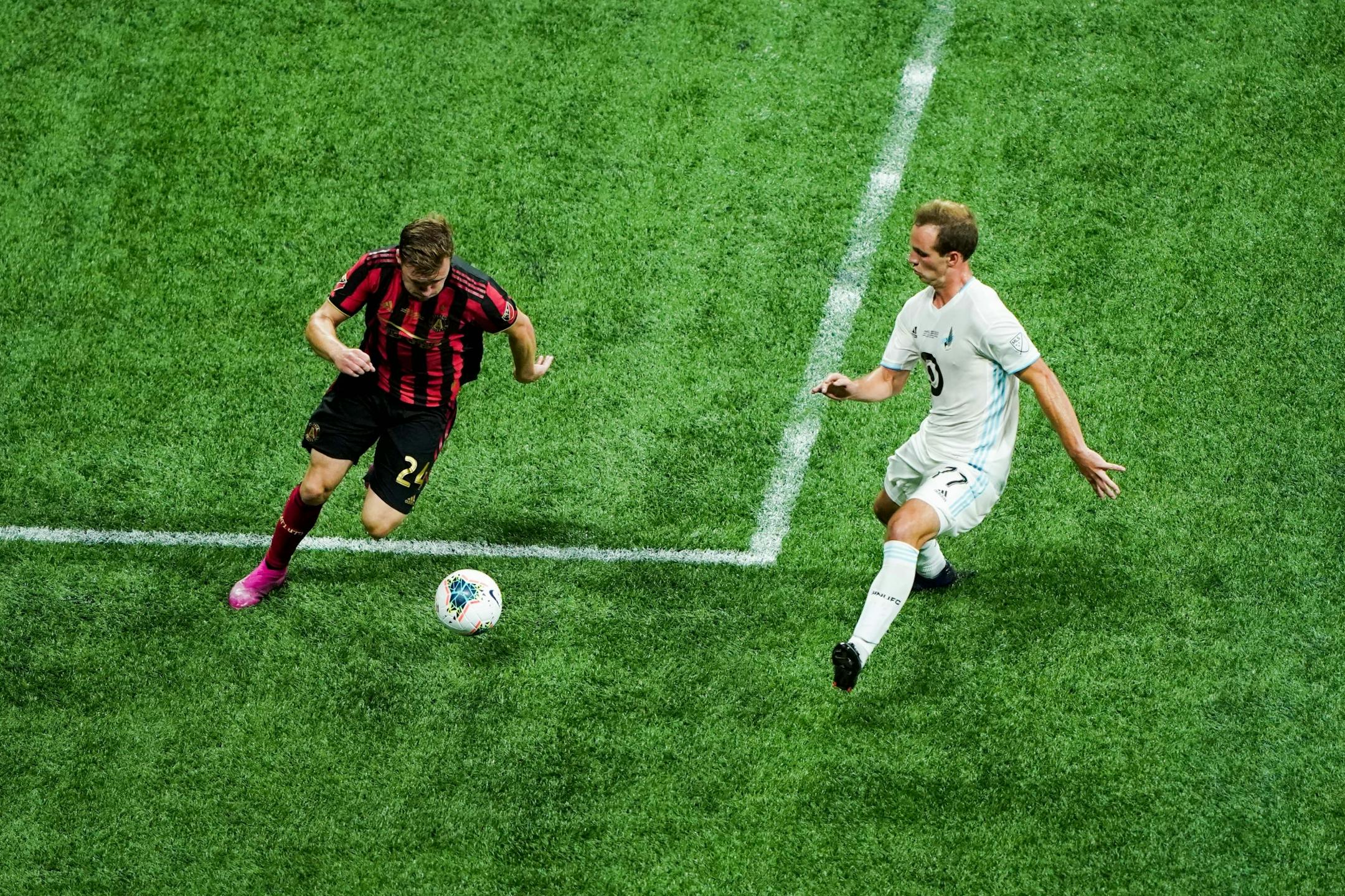 Minnesota United defender Chase Gasper (77) defends Atlanta United defender Julian Gressel (24) during the U.S. Open Cup at Mercedes-Benz Stadium in Atlanta on Tuesday, Aug. 27, 2019. Photo by Kevin D. Liles for the Star Tribune