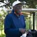 Bob Shelton smiled as he put on his gloves for a Tuesday Morning golf league at Hiawatha Golf Course in Minneapolis, Minn., on Tuesday, June 4, 2019. 