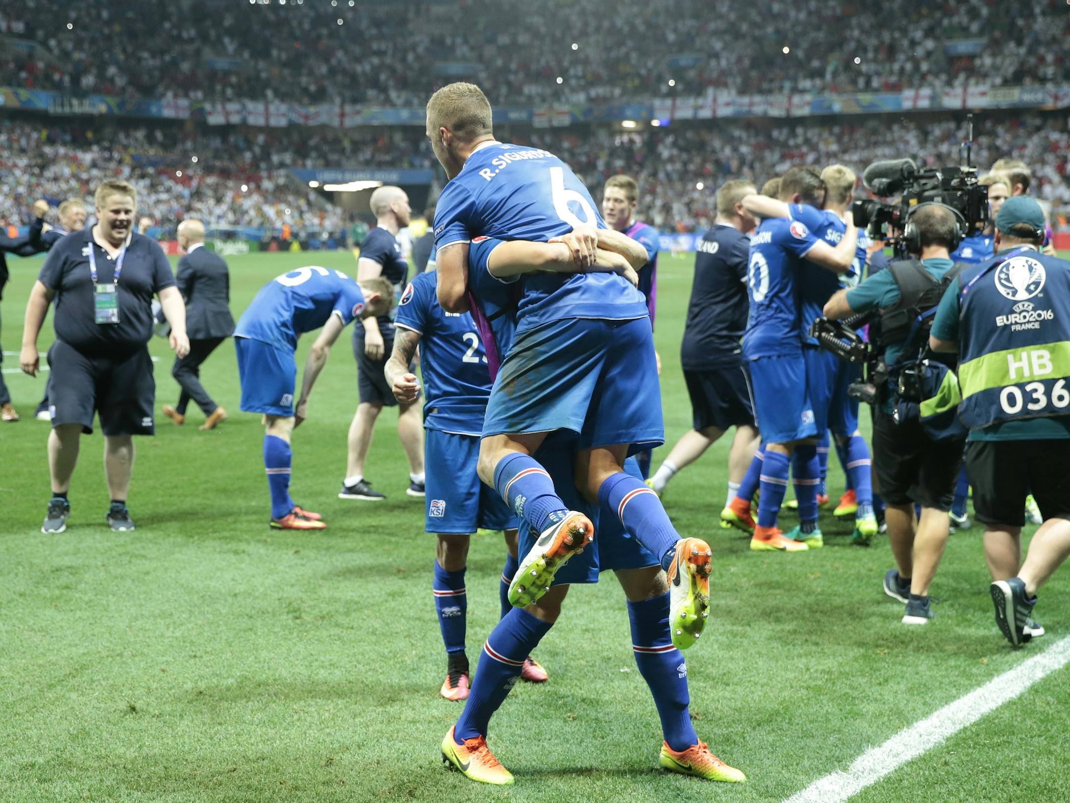 Iceland's players celebrate at the end of the Euro 2016 round of 16 soccer match between England and Iceland, at the Allianz Riviera stadium in Nice, France, Monday, June 27, 2016. Iceland won 2-1. (AP Photo/Pavel Golovkin)