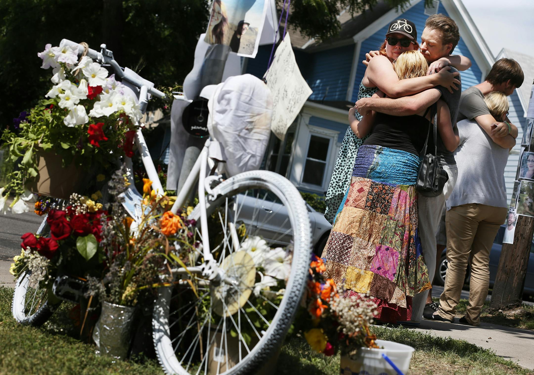 Co-workers Rachael Kopel left, John Blue, and Andrea Gardner hugged at the scene where Jessica Hanson was killed. Members of the police department and the family of 24-year old bicyclist Jessica Hanson, gathered at the site to talked about the arrest of a suspect Monday July 8, 2013 in Minneapolis, MN . Hanson died at 28th and Pleasant after being struck during an hit and run.] JERRY HOLT &#x201a;&#xc4;&#xa2; jerry.holt@startribune.com