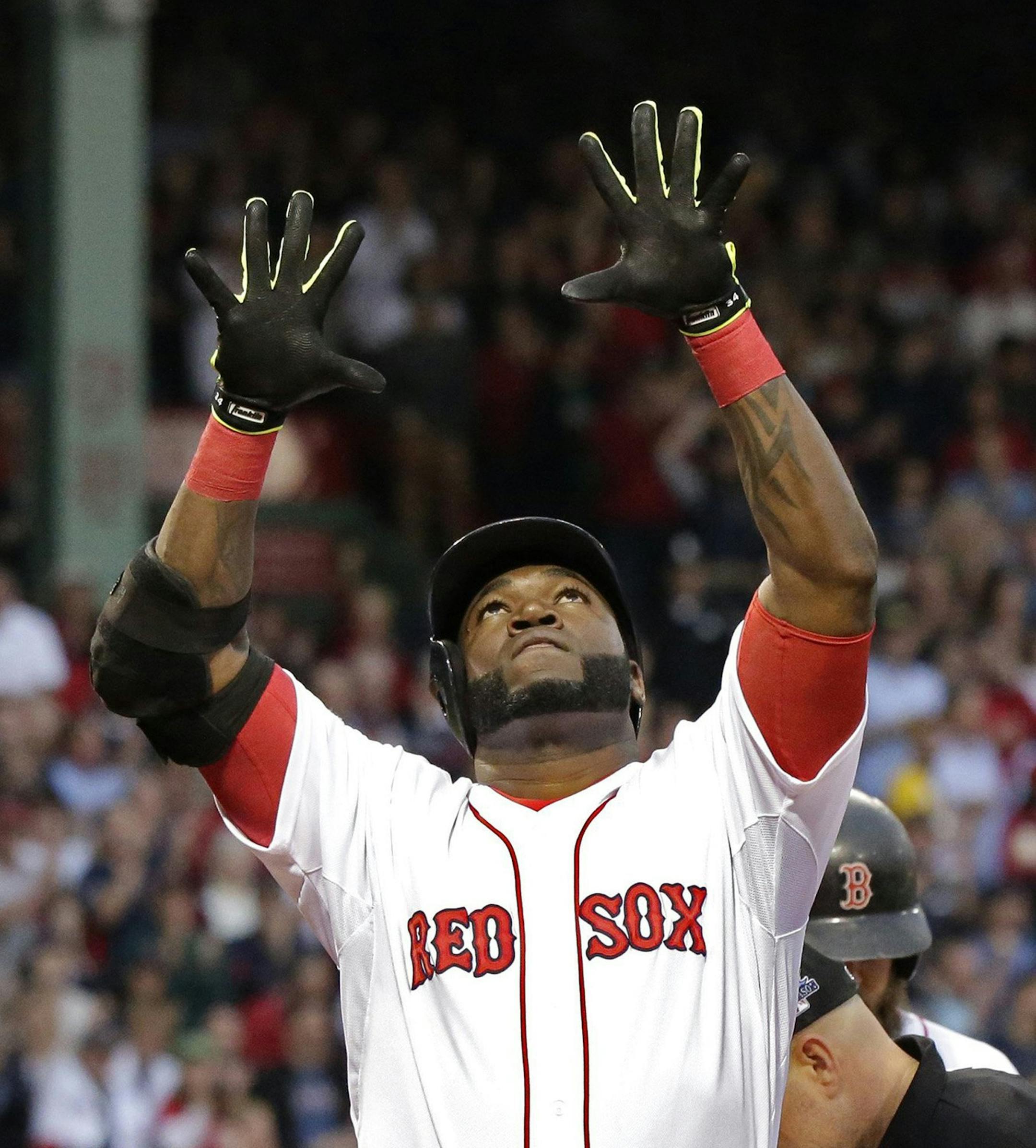 David Ortiz of the Boston Red Sox celebrates his solo home run off David Price of the Tampa Bay Rays in the first inning in Game 2 of the American League Division Series at Fenway Park in Boston, Massachusetts, on Saturday, October 5, 2013.