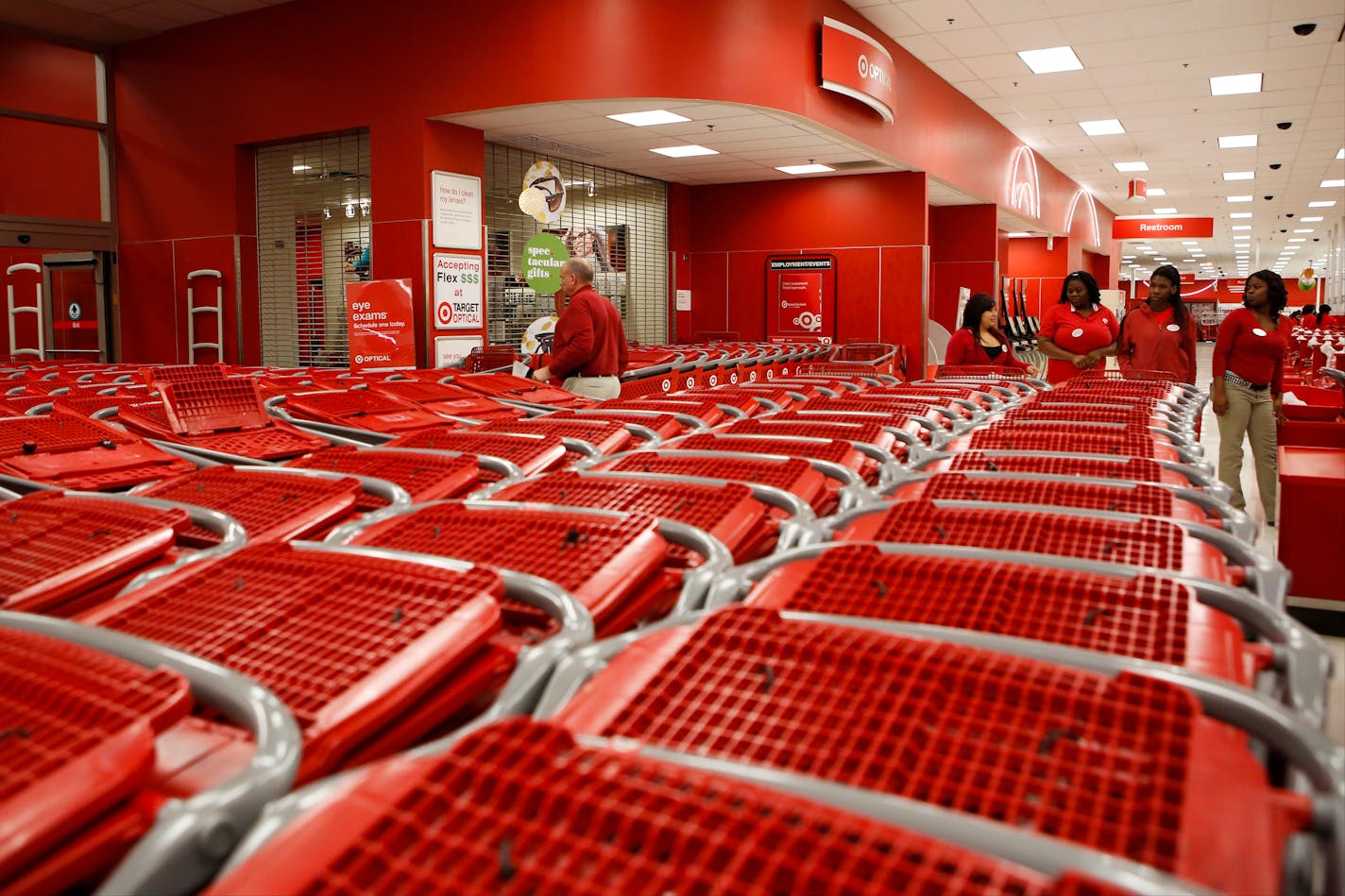 Nov. 28, 2013: Employees arrange shopping carts in lines for customers at a Target Corp. store ahead of Black Friday in Chicago.