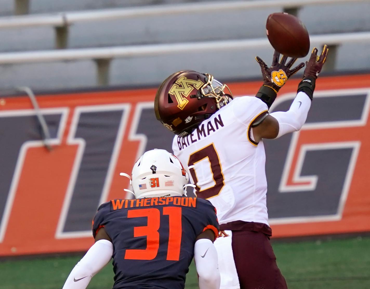 Gophers wide receiver Rashod Bateman catches a touchdown pass from quarterback Tanner Morgan, as Illinois defensive back Devon Witherspoon defends during the first half