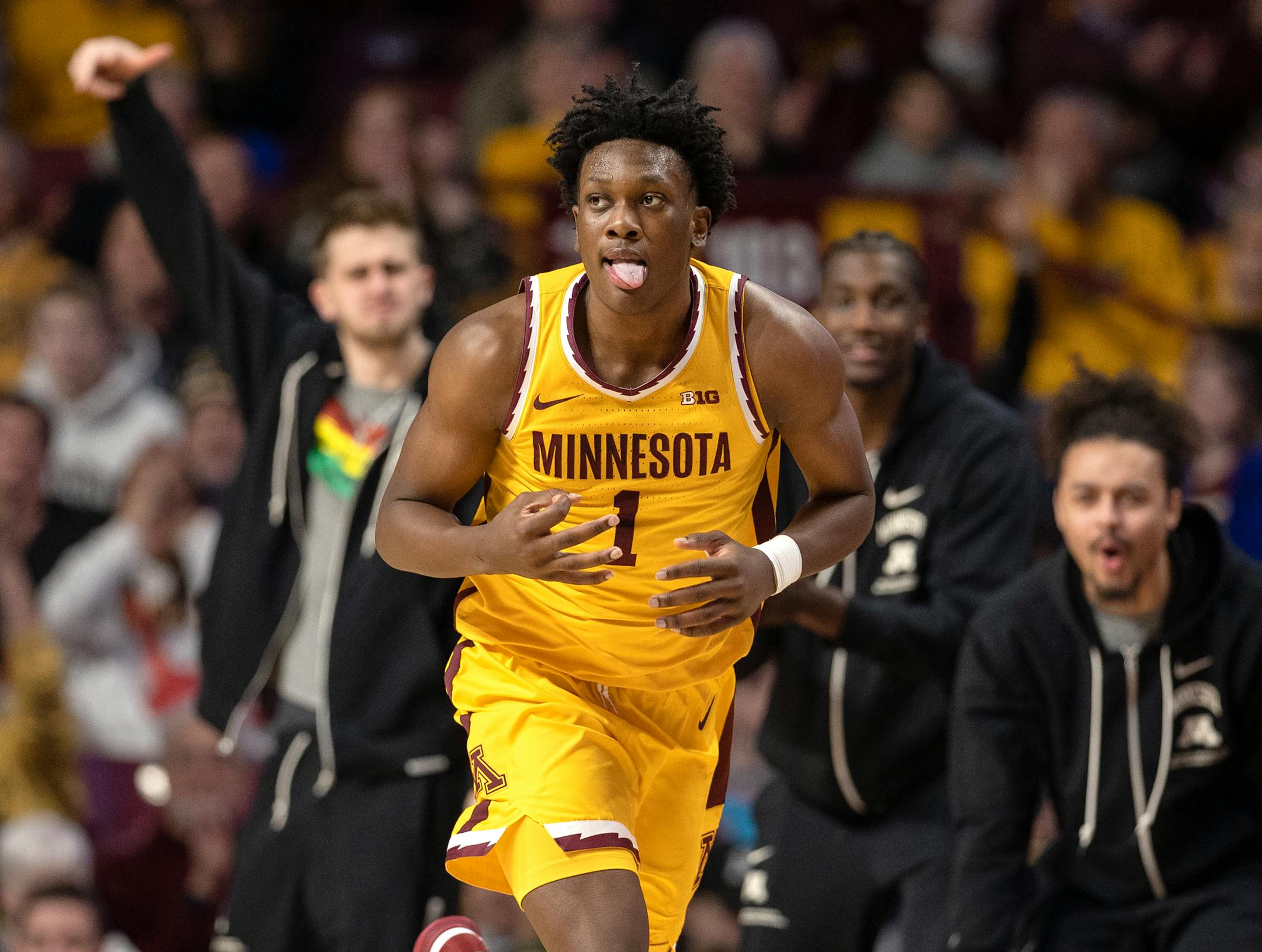 Joshua Ola Joseph (1) of the Minnesota Gophers reacts after making a three pointer in the second half.