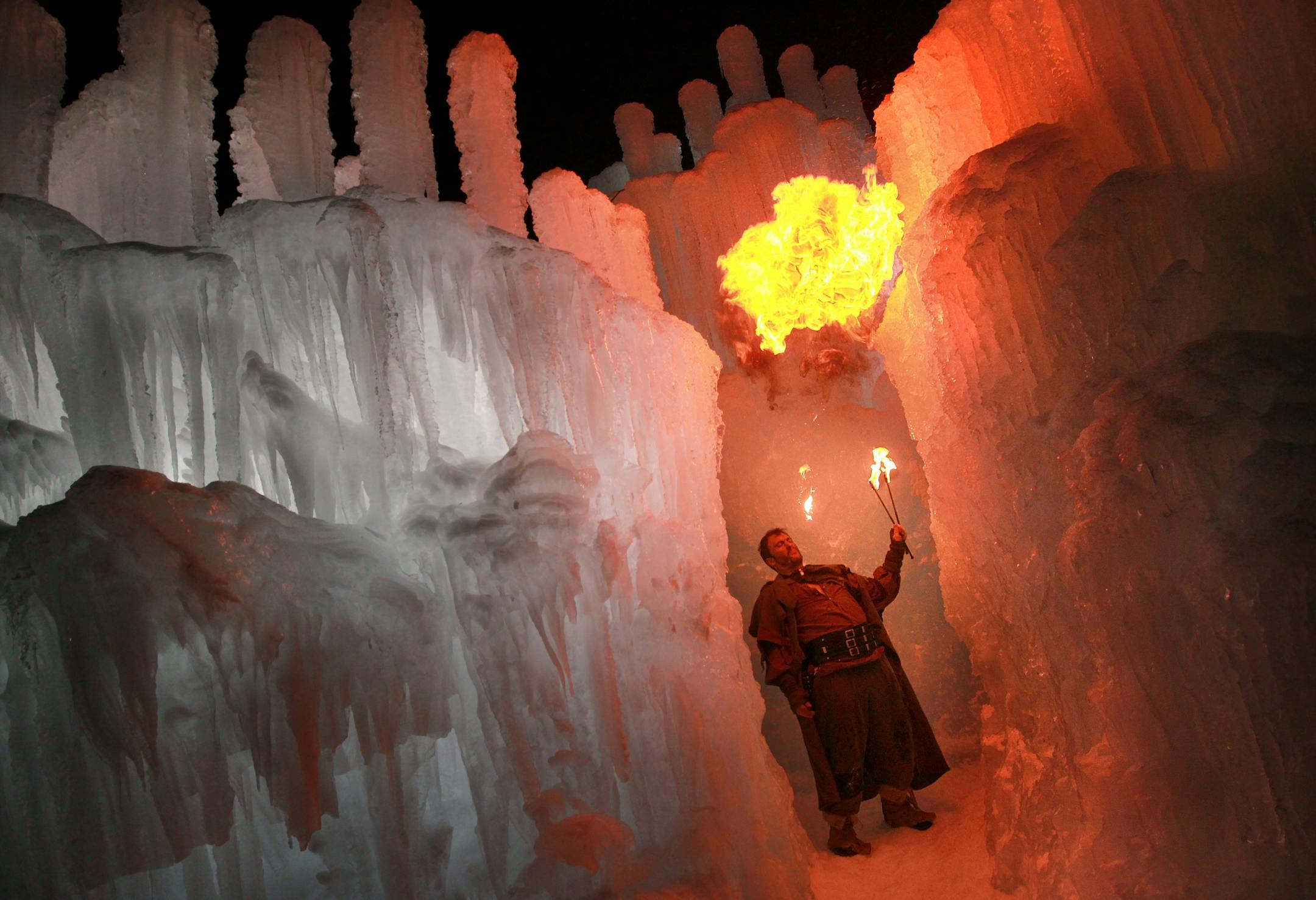 Fire and ice: Fire eater Ryan Hansmeyer performed Sunday night during the VIP opening of the Ice Castles at Mall of America. The two-acre attraction is in the mall's north parking lot.