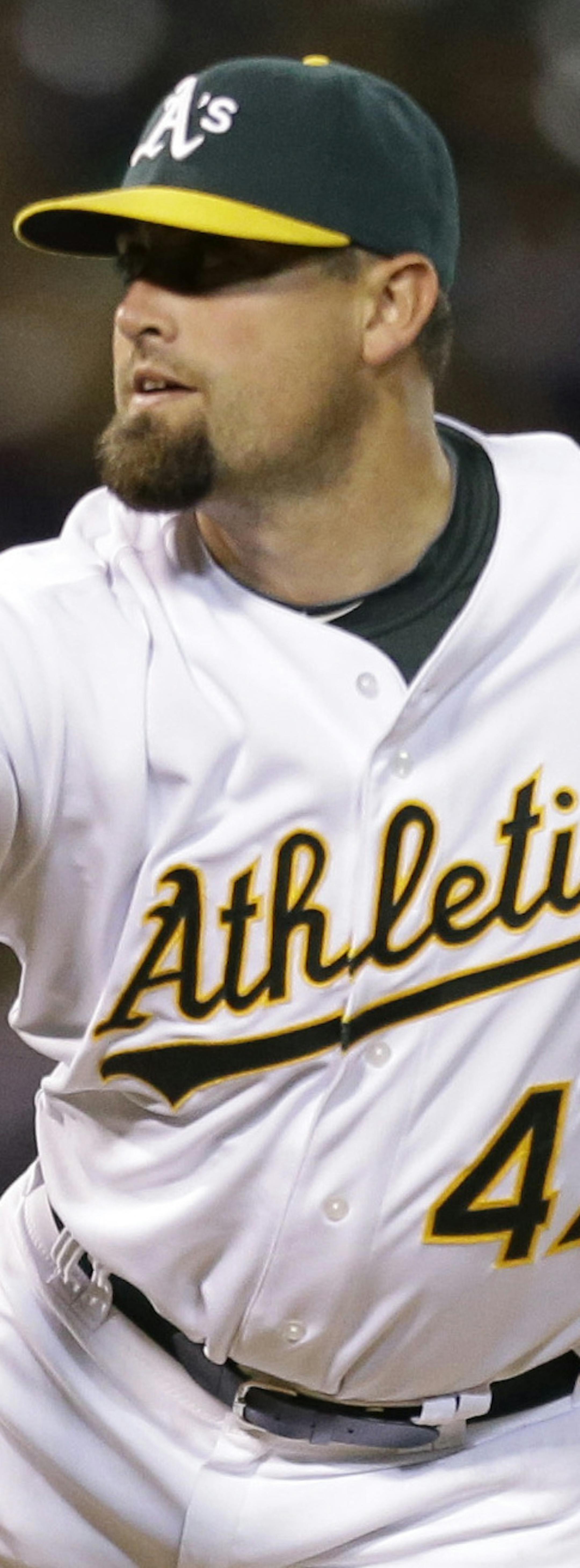Oakland Athletics' Pat Neshek follows through on a delivery to the Seattle Mariners in the sixth inning of a baseball game Tuesday, April 2, 2013, in Oakland, Calif. (AP Photo/Ben Margot) ORG XMIT: OAS116