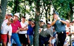 August 21, 1994 Burnet Senior Classic final round. The Crowds watch as Dave Stockton hits a shot through the trees and on the 14th green. Dave Stockto