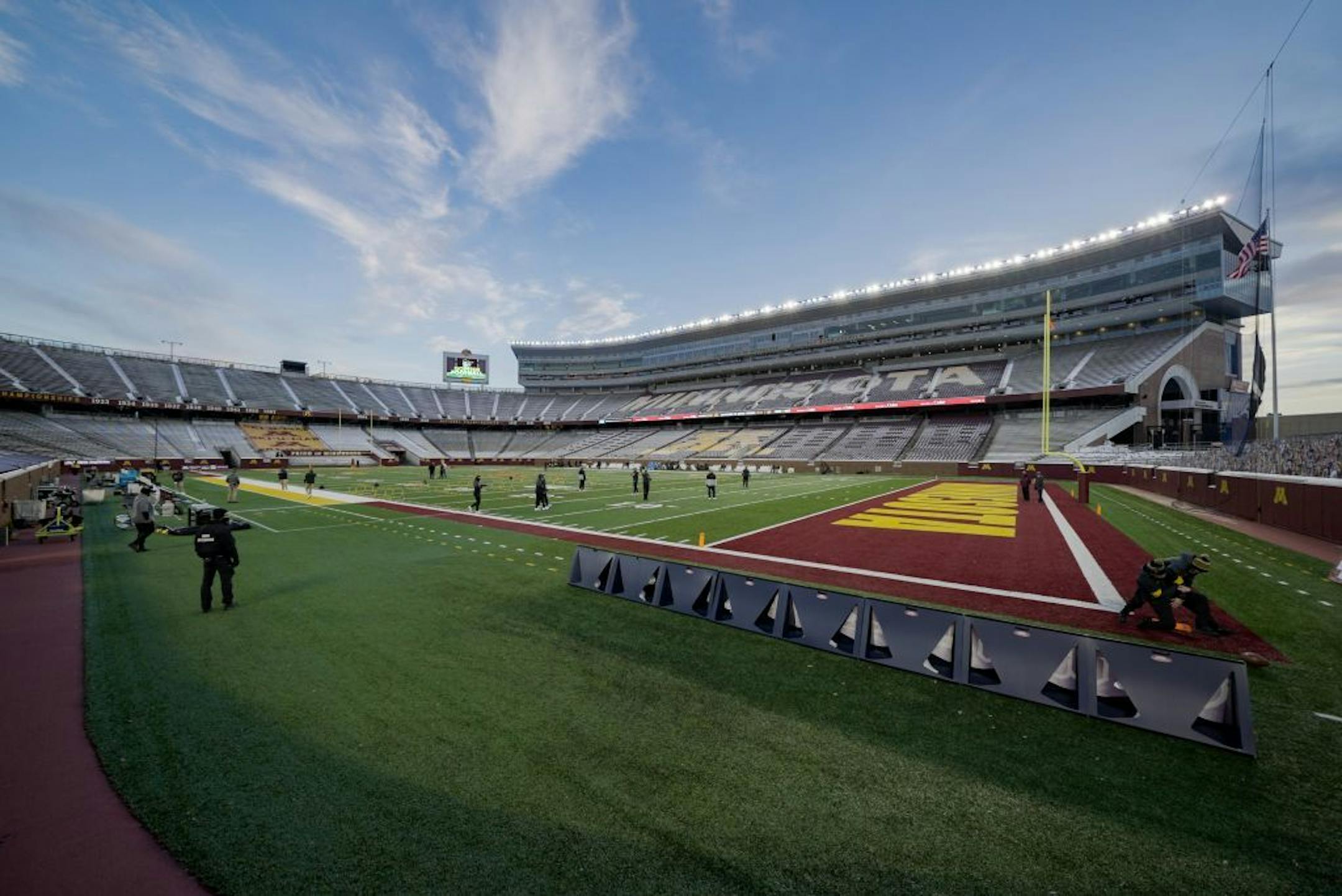 Iowa Hawkeyes staff worked the field before the game.