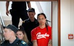 WNBA star and two-time Olympic gold medalist Brittney Griner was escorted to a courtroom for a hearing in Khimki, outside Moscow, in July.