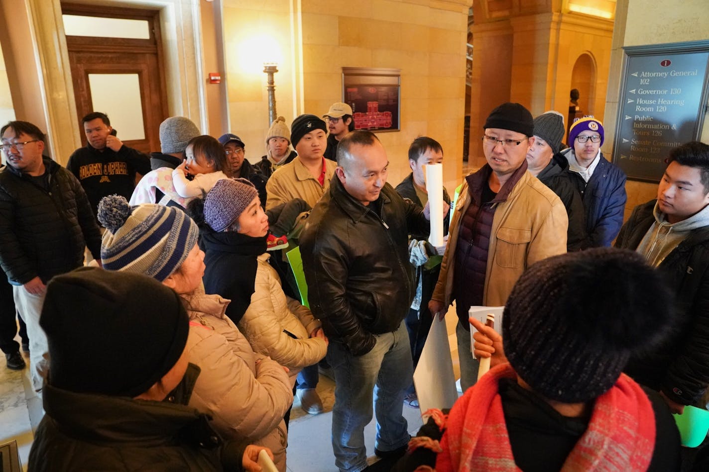 Water Gremlin workers gathered on the first floor of the Capitol after meeting with Kristin Beckmann, deputy chief of staff to Governor Walz, in the Governor's reception room to ask that the business not be shut down. Some brought their small children to make the point that their company is safe.