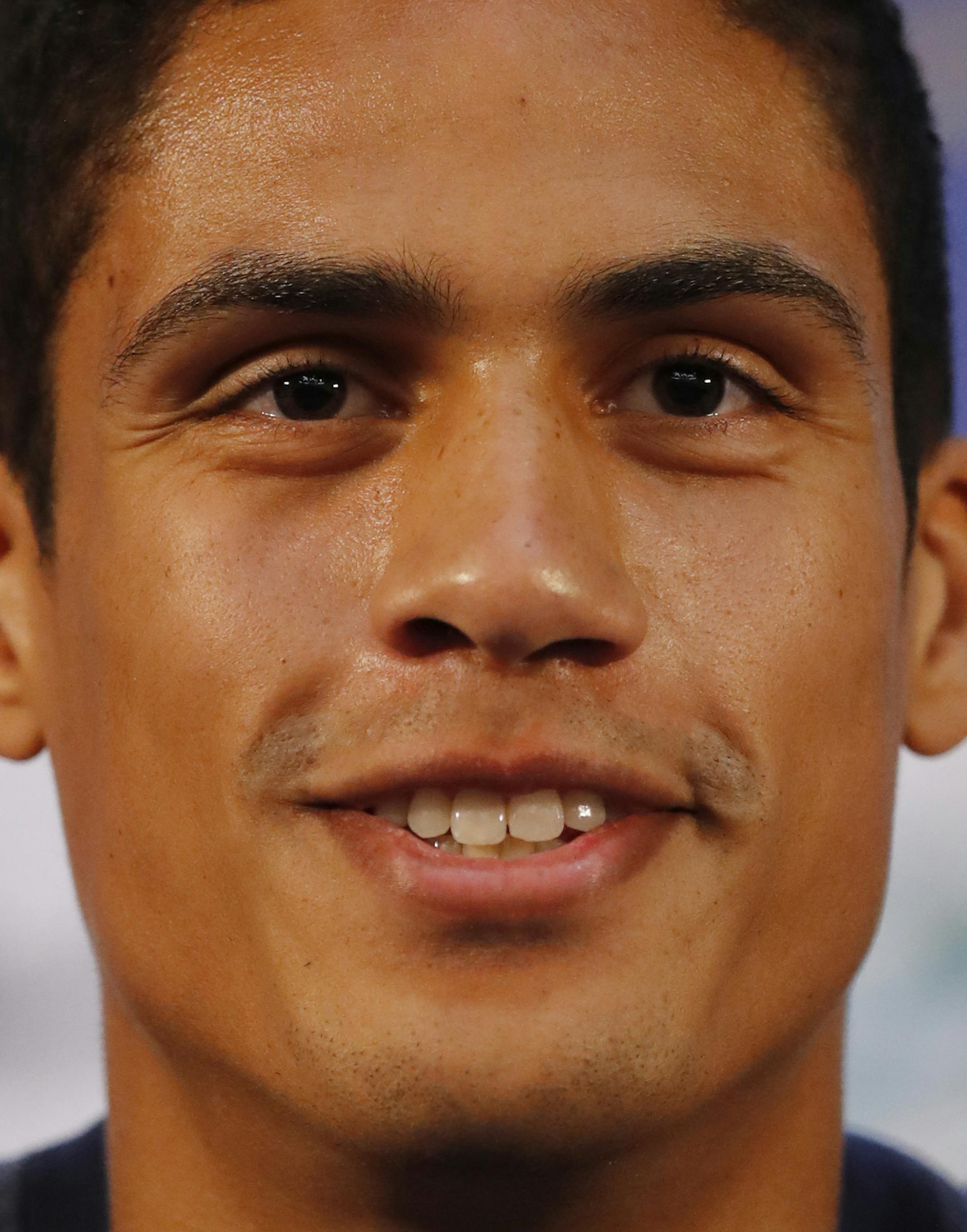 France's Raphael Varane smiles as he answers journalists during a press conference at the 2018 soccer World Cup in Istra, Russia, Saturday, July 7, 2018. (AP Photo/David Vincent)