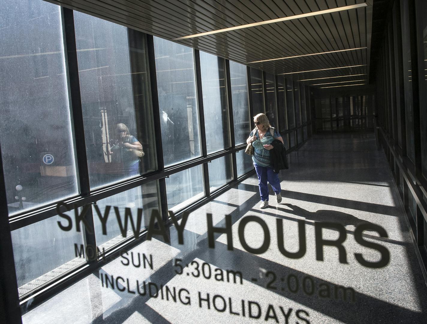 Vicky Johnson, of Stacy, Minn., walked through the skyway attached to 180 East Fifth Street in downtown St. Paul Thursday night as she left her job at the Department of Public Safety. "I've noticed since the union depot opened and the buses are down there now and it's open 24 hours a day, there's a lot more panhandling now." said Johnson. "I'm aware of my surroundings a little more than I would be." ] (AARON LAVINSKY/STAR TRIBUNE) aaron.lavinsky@startribune.com St. Paul's skyways have become a p