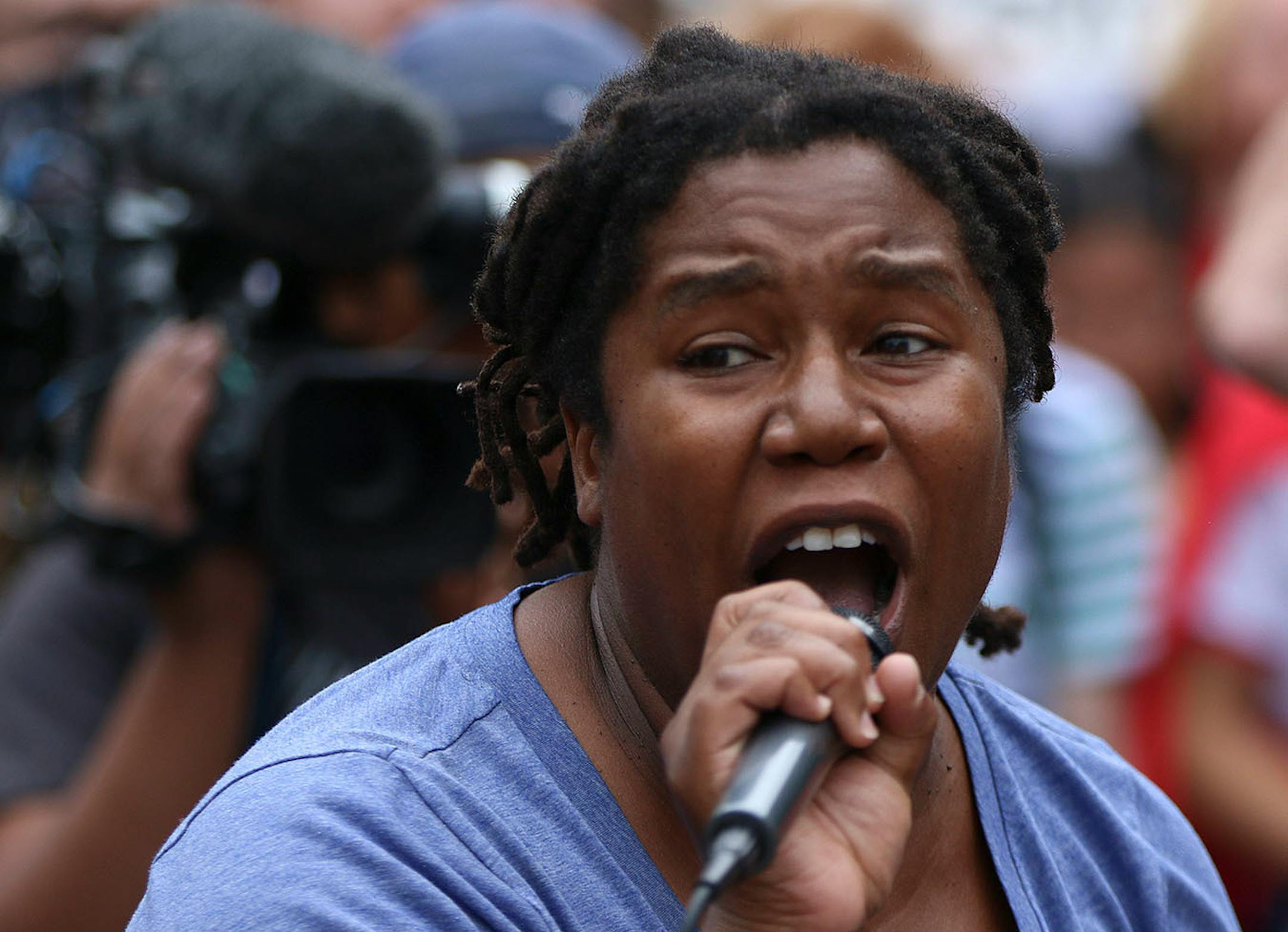 A protester leads fellow demonstrators in chants that delayed the pride parade on Sunday.