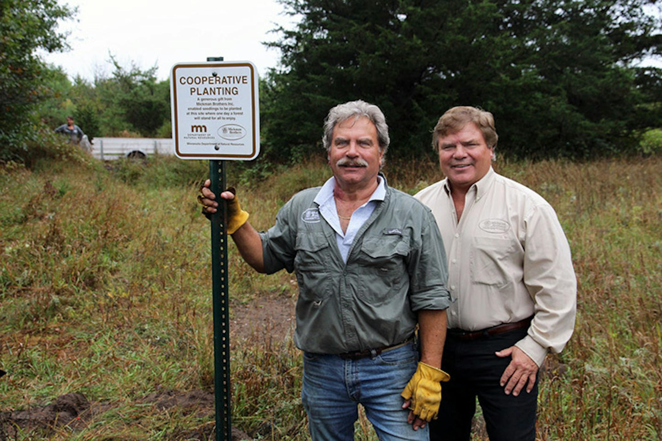 Founder John Mickman and brother Chris Mickman at state land being reforested by Mickman Brothers contributions.