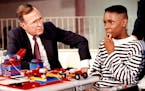 Elijah Pughsley, pictured in 1991, pondered a moment before he answered President George H.W. Bush's question during a visit to the Saturn School of T