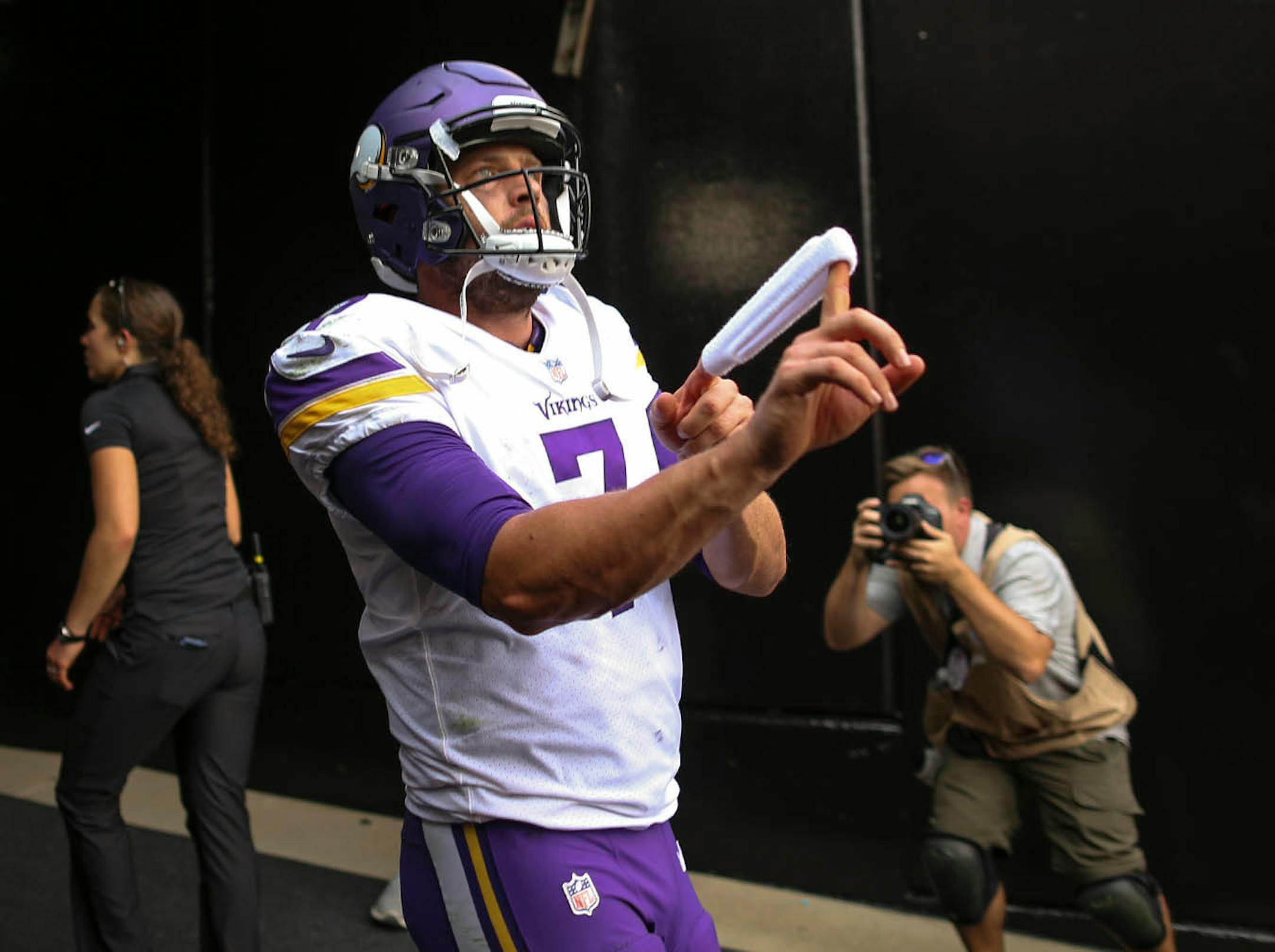 Minnesota Vikings quarterback Case Keenum shot a wristband to a fan as he left the field after his debut as a starting quarterback.