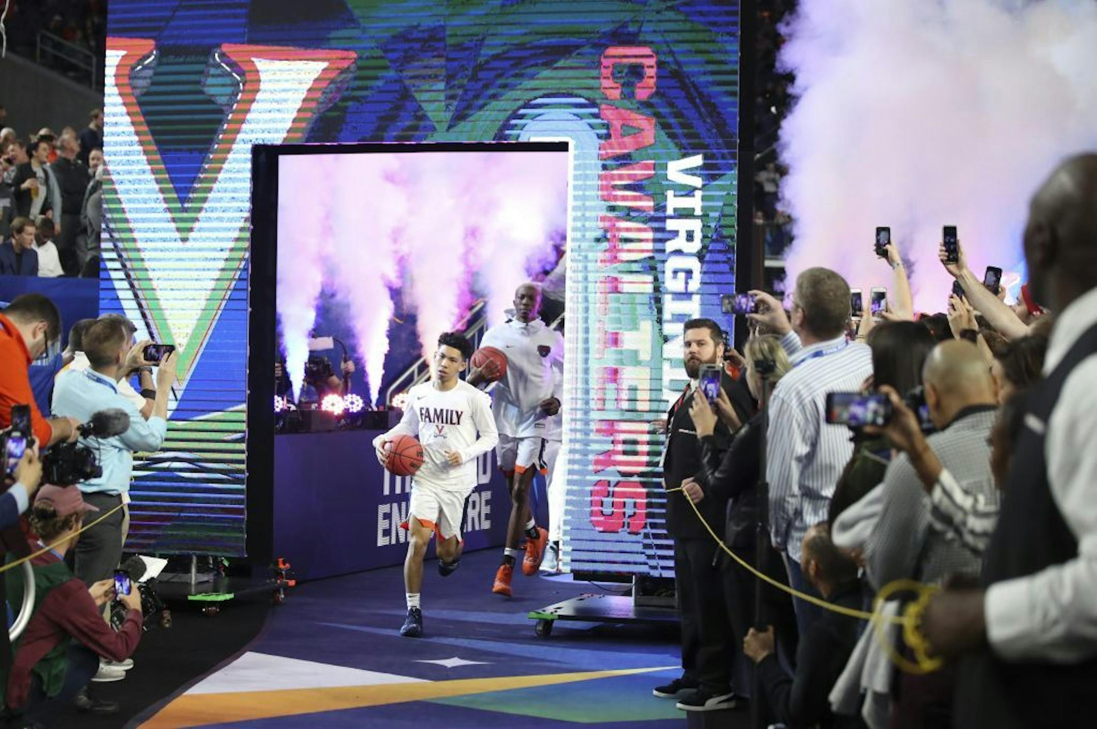 Virginia Cavaliers guard Kihei Clark (0) ran towards the court before the first game of the night.