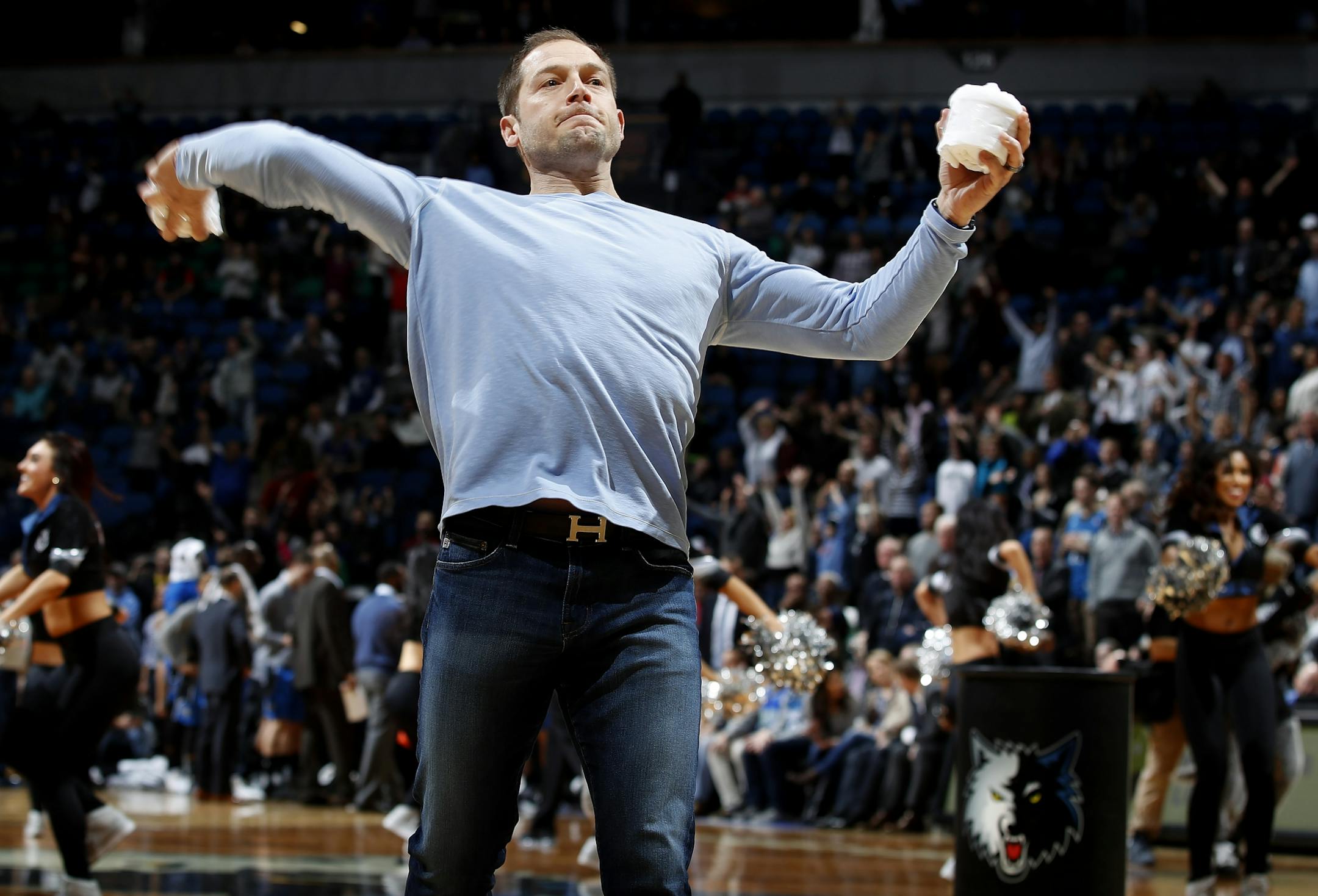 University of Minnesota Gophers head football coach P.J. Fleck threw out t-shirts during a time out.