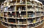 FILE - This June 16, 2016 file photo made with a fisheye lens shows bottles of alcohol during a tour of a state liquor store in Salt Lake City. A larg