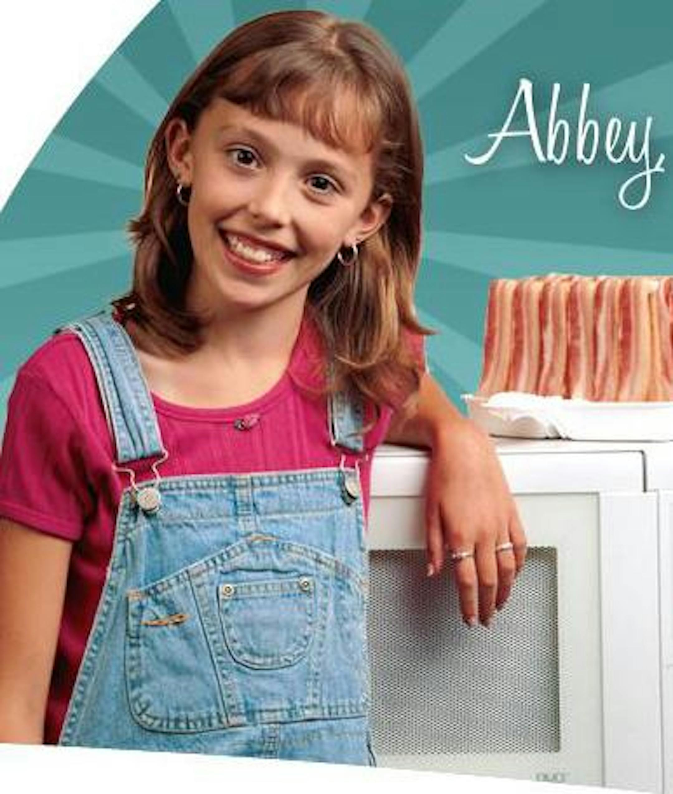 Abbey Fleck was about 10 when her photo started appearing 23 years ago on Makin Bacon packages.
