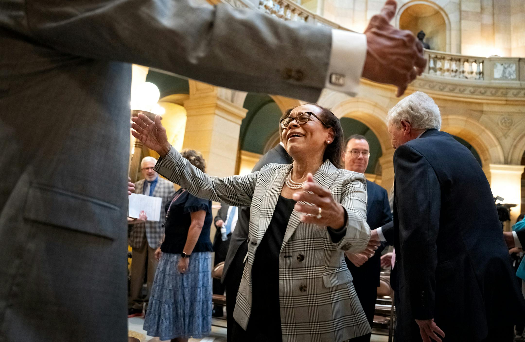 Natalie Hudson smiled as she got a big hug from her uncle DeOnne Hudson Wednesday in St. Paul. Governor Tim Walz announced Hudson will become the new chief justice of the Minnesota Supreme Court and Karl Procaccini will become an associate justice.