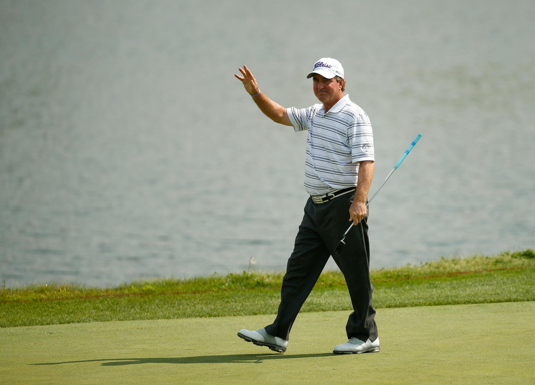 Gene Sauers acknowledged the cheers of the gallery after sinking a putt on the 17th green Sunday afternoon at the TPC in Blaine. ] JEFF WHEELER • jeff.wheeler@startribune.com The 3M Championship concluded on Sunday afternoon with Kenny Perry winning by a stroke over a Bernhard Langer at the Tournament Players Club Twin Cities in Blaine August 3, 2014.