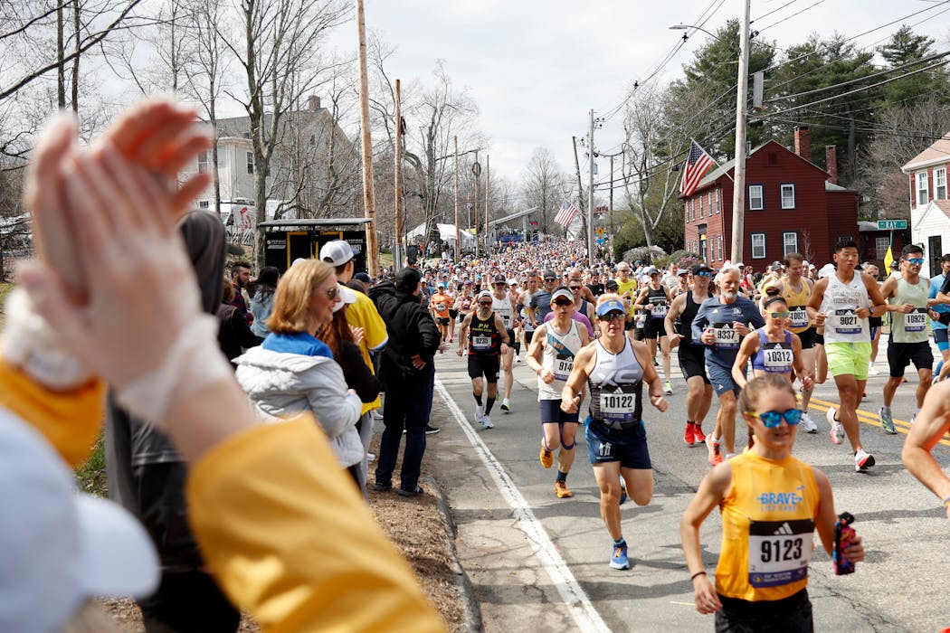 Runners make their way from the start of the Boston Marathon in Hopkinton, Mass. 