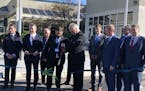 SkyWater Technology CEO Tom Sonderman, with scissors, cuts the ribbon on an expansion of the company's semiconductor factory in Bloomington on Monday.