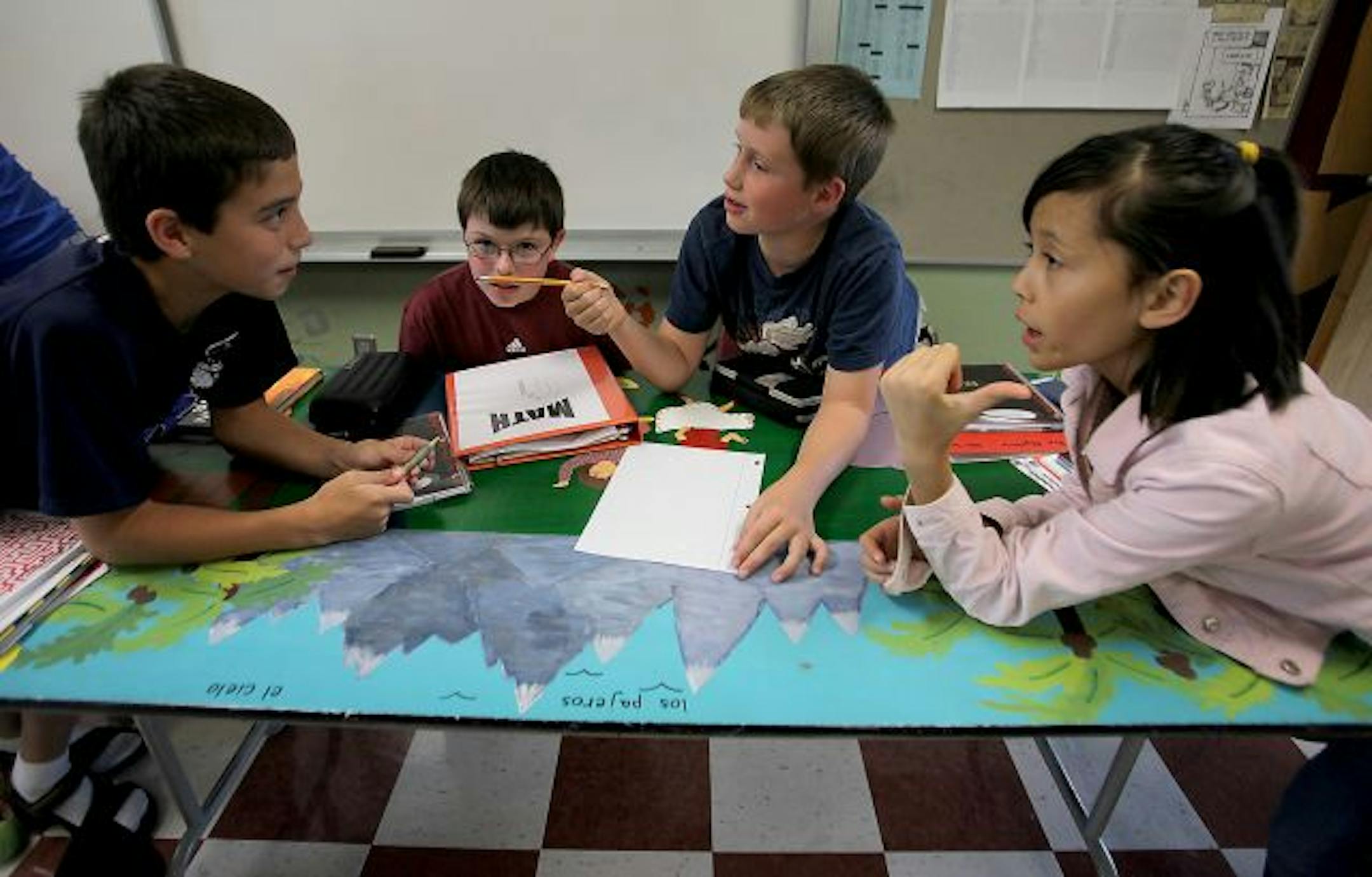 Sixth-graders Adam LeMay, 14, left, Grant Sunderman, 12, John Sampson, 11, and Jade Arrowsmith, 11, in class at the Math and Science Academy.