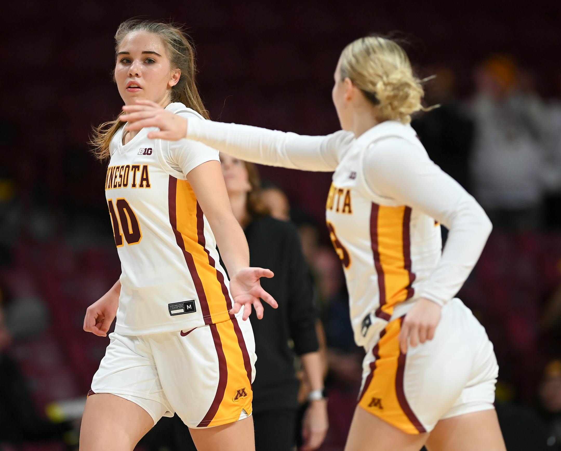 Minnesota Gophers guard Katie Borowicz (23) and guard Mara Braun (10) celebrate a 3-pointer by Braun during the second half.