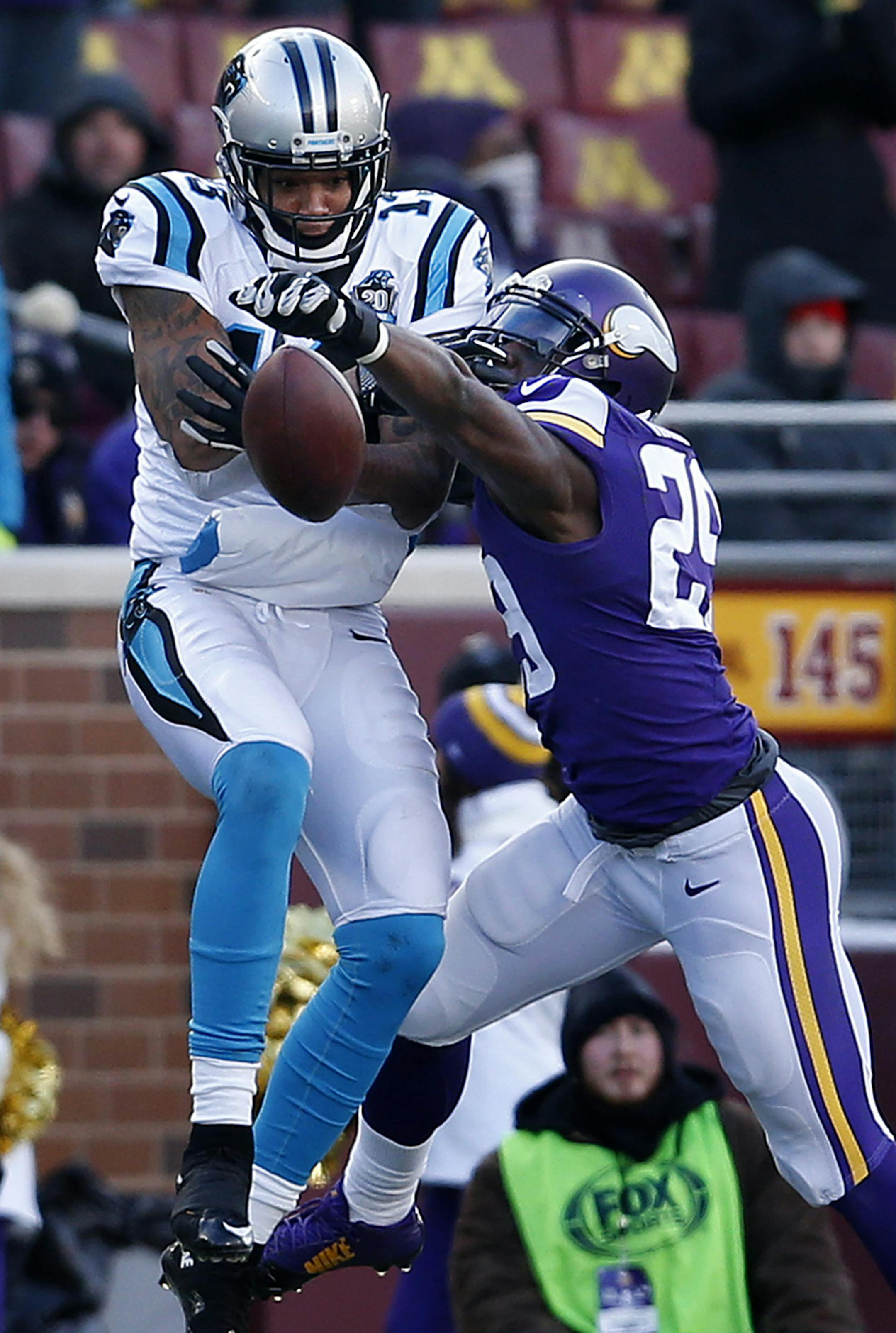 Xavier Rhodes (29) broke up a pass intended for Kelvin Benjamin (13) in the third quarter. ] CARLOS GONZALEZ cgonzalez@startribune.com - November 30, 2014, Minneapolis, Minn., TCF Bank Stadium, NFL, Minnesota Vikings vs. Carolina Panthers