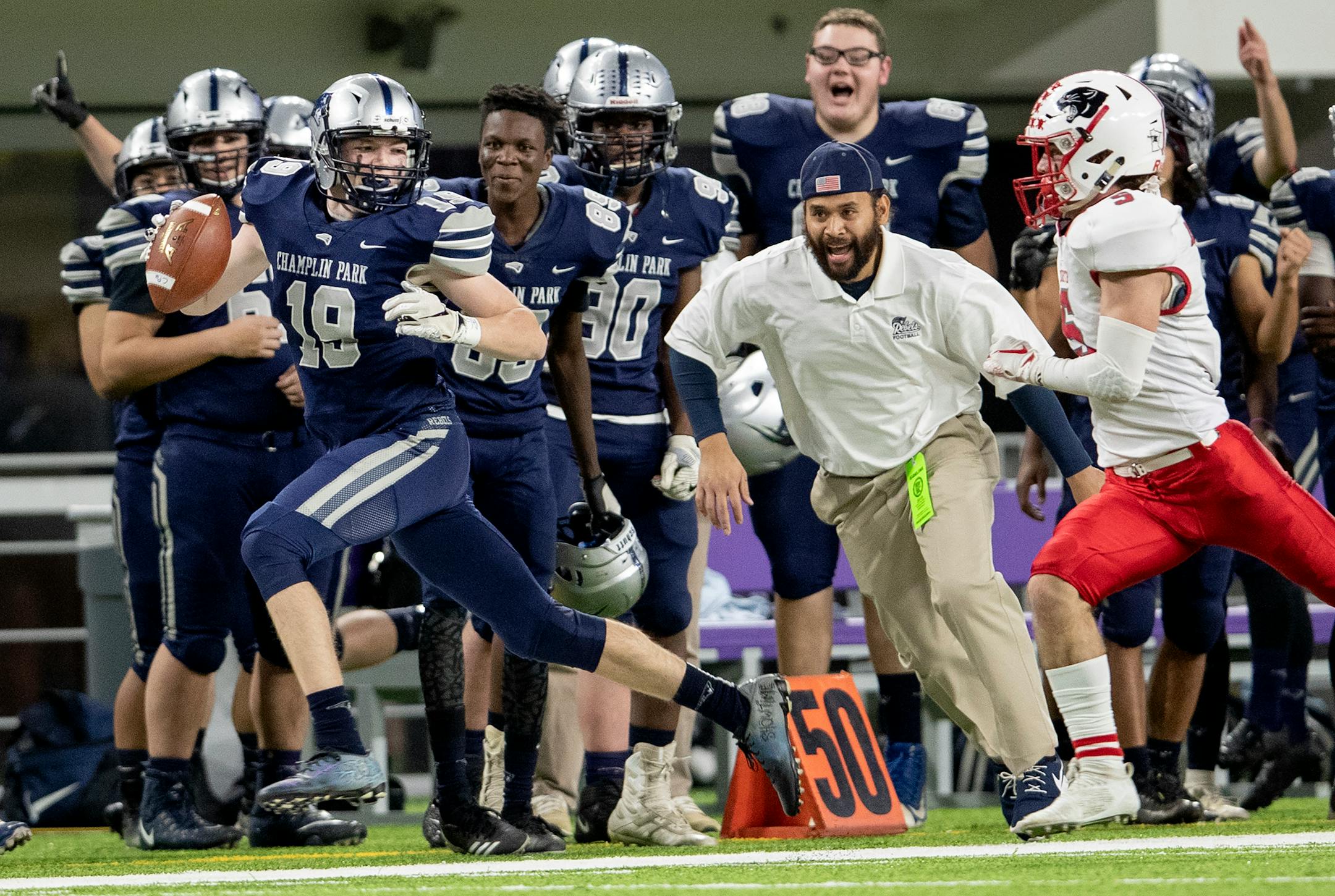 Dom Witt of Champlin Park ran after a catch in the first quarter of the Class 5A semifinals.