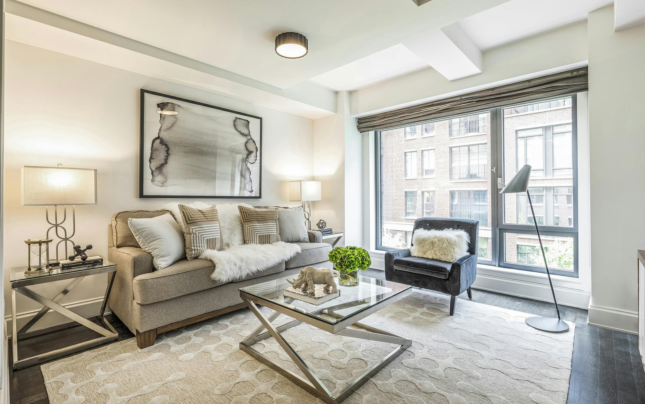 This winter white/taupe sofa helps anchor this den.